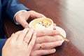 Cup of coffee and hands newlywed Royalty Free Stock Photo