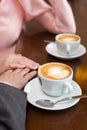 Cup of coffee and hands newlywed Royalty Free Stock Photo