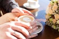 Cup of coffee and hands newlywed Royalty Free Stock Photo