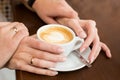 Cup of coffee and hands newlywed Royalty Free Stock Photo