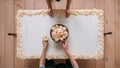 Cup of coffee in hands on table. Rose petals. Flatlay Royalty Free Stock Photo