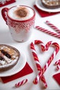 Cup of coffee with heart shape christmas candy and mini cakes. Royalty Free Stock Photo