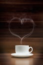 Cup of coffee with heart-shaped smoke Royalty Free Stock Photo