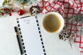 Cup of coffee, holiday decorations and paper to do list on white table top view, Christmas planning concept. Flat lay style. Happy