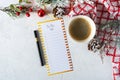 Cup of coffee, holiday decorations and paper to do list on white table top view, Christmas planning concept. Flat lay style. Happy