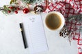 Cup of coffee, holiday decorations and paper to do list on white table top view, Christmas planning concept. Flat lay style. Happy