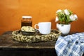 cup coffee with homemade chocolate chip cookies with honey jar and roses flowers on wood table Royalty Free Stock Photo