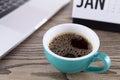 A cup of coffee on the indoor desk