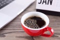 A cup of coffee on the indoor desk