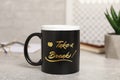 Cup of coffee with inscription Take a Break on grey table Royalty Free Stock Photo