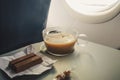 cup with coffee interior of airplane. Royalty Free Stock Photo