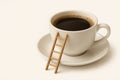 A cup of coffee with a ladder attached to it. Space for text. Royalty Free Stock Photo