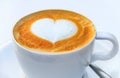 Cup of coffee with a latte art heart design at a cafe in Palma de Mallorca in Spain Royalty Free Stock Photo