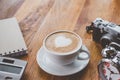 Cup of Coffee latte art Heart shape with office tools on table Royalty Free Stock Photo