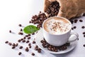 Cup of coffee latte and coffee beans isolated on white background Royalty Free Stock Photo