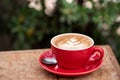 Cup of coffee latte in the morring,red cup Royalty Free Stock Photo
