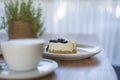 Cup of coffee latte or tea and dessert on wooden table. Coffee shop or confectionery Royalty Free Stock Photo