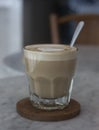 A cup of coffee latte on a wooden table