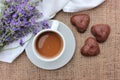 Cup of coffee with lavender flowers and waffle on burlap texture. Top view. Selective focus Royalty Free Stock Photo