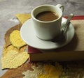 A cup of coffee and leaves Royalty Free Stock Photo