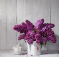 Cup of coffee and Lilac Bouquet