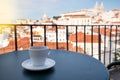 Cup of coffee and Lisbon cityscape