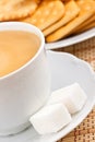 Cup of coffee with a lump sugar and crackers Royalty Free Stock Photo