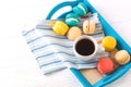 Cup of coffee and macaron cakes on tray Royalty Free Stock Photo