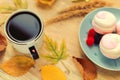 Cup of coffee, marshmallow, autumn yellow leaves - autumn breakfast.