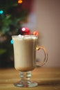 Cup of coffee with marshmallow on wooden table Royalty Free Stock Photo