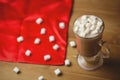 Cup of coffee with marshmallow on wooden table Royalty Free Stock Photo