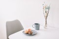 Cup of coffee with marshmallows and flowers on the table. Romantic morning. Tasty breakfast. Flat lay, top view, copy space. Royalty Free Stock Photo