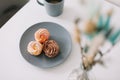 Cup of coffee with marshmallows and flowers on the table. Romantic morning. Tasty breakfast. Flat lay, top view, copy space. Royalty Free Stock Photo