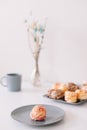 Cup of coffee with marshmallows and flowers on the table. Romantic morning. Tasty breakfast. Flat lay, top view, copy space. Royalty Free Stock Photo