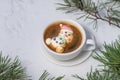 Cup of coffee with marshmallows. Marshmallow snowman in a Santa Claus hat. Winter drink in the snow. Christmas tree. Top Royalty Free Stock Photo