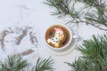 Cup of coffee with marshmallows. Marshmallow snowman in a Santa Claus hat. Winter drink in the snow. Christmas tree. Top Royalty Free Stock Photo