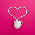 Cup of coffee and marshmallows on pink background. Heart. Flat lay. Top view Royalty Free Stock Photo