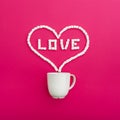 Cup of coffee and marshmallows on pink background. Heart. Flat lay. Top view Royalty Free Stock Photo