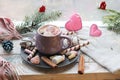 Cup of coffee with meringues and dessert on a plate, Christmas decor, hearts on the windowsill