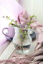 A cup of coffee, meringues, flowering branches of cherry on the windowsill Royalty Free Stock Photo
