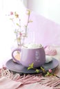 A cup of coffee, meringues, flowering branches of cherry on the windowsill Royalty Free Stock Photo