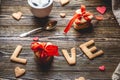 Cup of coffee and a message from a sweet cookie in the form of the word love. Romantic Valentine`s day gift Royalty Free Stock Photo