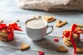 Cup of coffee and a message from a sweet cookie in the form of the word love. Romantic Valentine`s day gift Royalty Free Stock Photo