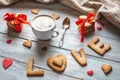 Cup of coffee and a message from a sweet cookie in the form of the word love. Romantic Valentine`s day gift Royalty Free Stock Photo