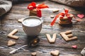 Cup of coffee and a message from a sweet cookie in the form of the word love. Romantic Valentine`s day gift Royalty Free Stock Photo