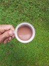 A Cup of Coffee Milk in Dreamy Green Garden