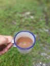 A Cup of Coffee Milk in Dreamy Green Garden