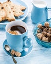 Cup of coffee, milk jug, cane sugar cubes and fruit-cake. Royalty Free Stock Photo