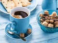 Cup of coffee, milk jug, cane sugar cubes and fruit-cake. Royalty Free Stock Photo