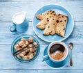 Cup of coffee, milk jug, cane sugar cubes and fruit-cake. Royalty Free Stock Photo